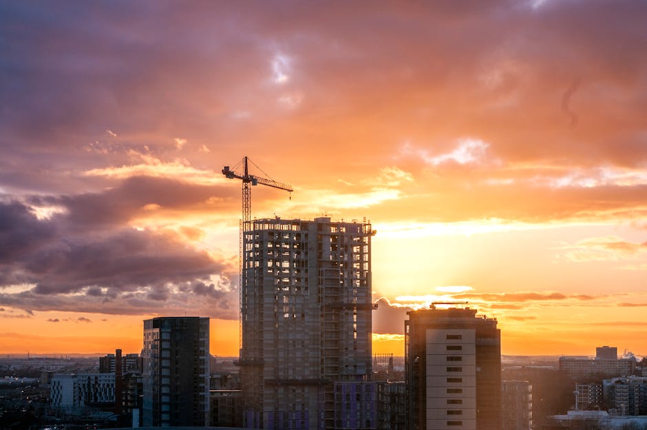 Captivating sunset scene over construction site in Manchester with dramatic skies.